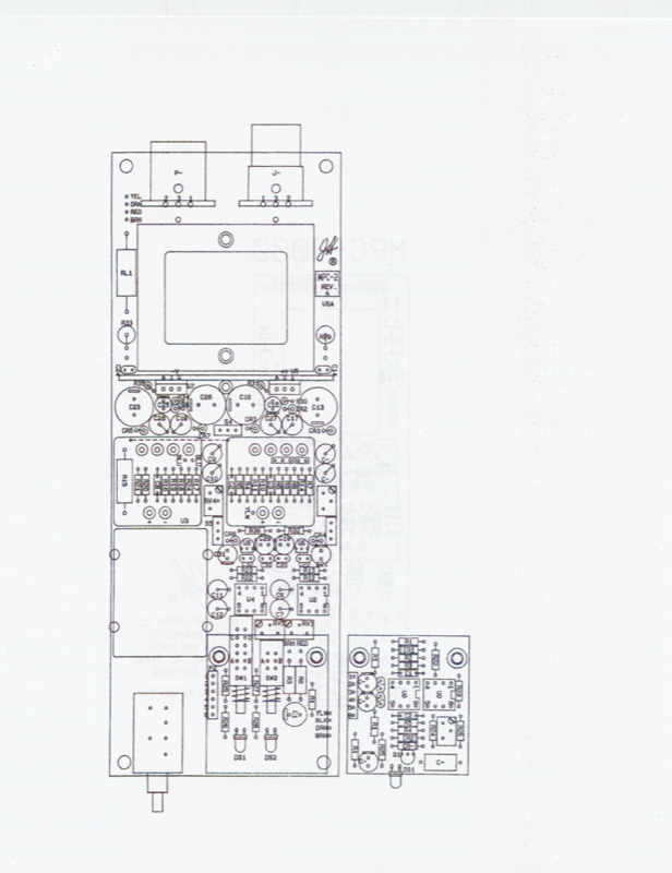 PCB component layout — dense board with ICs, capacitors, resistors, connectors